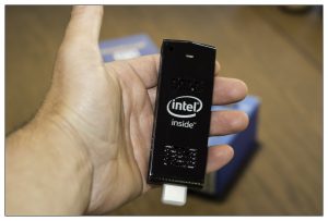 holding intel compute stick in hand