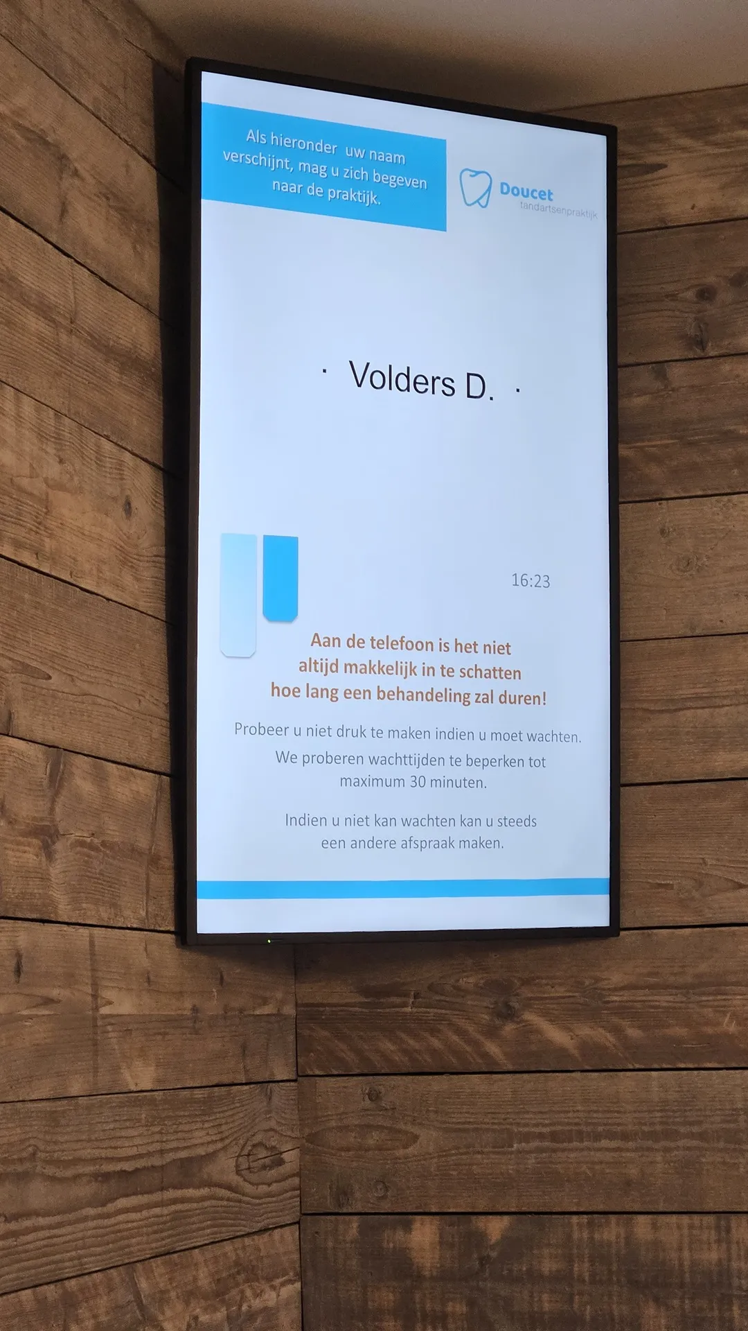 Dental practice information screen with advertising and calling in people